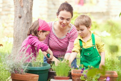 Patio, planting, and structured garden landscaping in Turnhamgreen